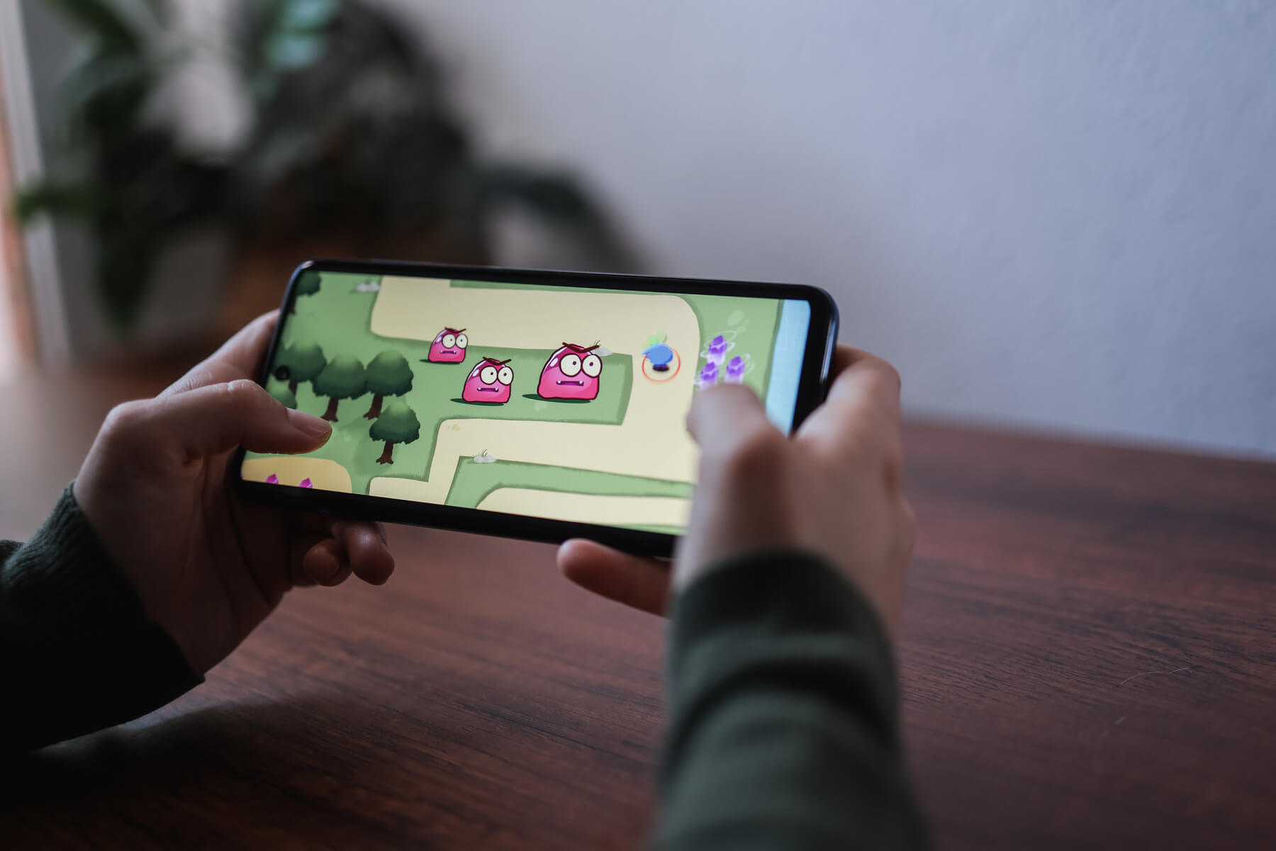 gamer playing online video games on mobile phone a 2023 11 27 05 04 16 utc.jpg